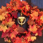Autumn wreath on a black door home staging