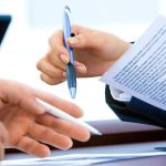 Two lawyers discussing aproperty valuation