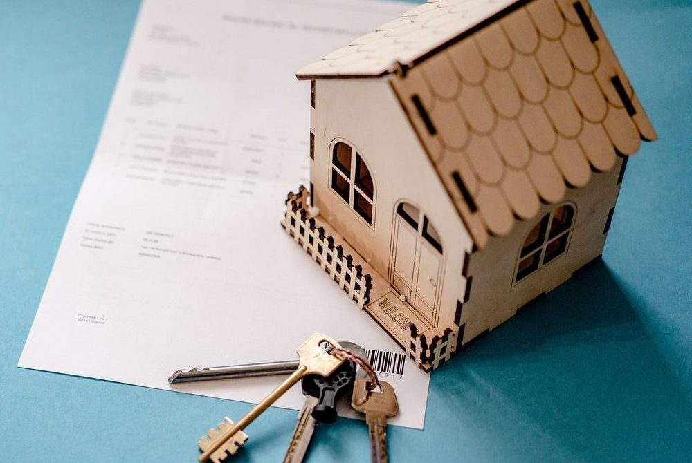 House keys and details of house sale, suggesting a house sale or house move.