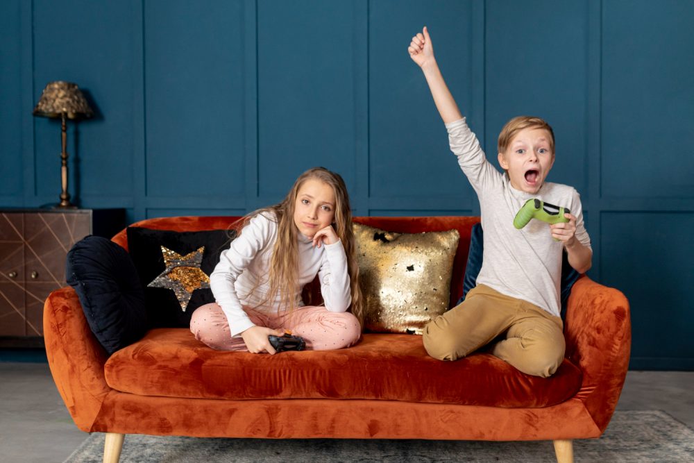 children playing video games on luxury velvet sofa